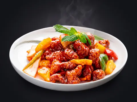 Pollo de corral agridulce con piña y pimientos